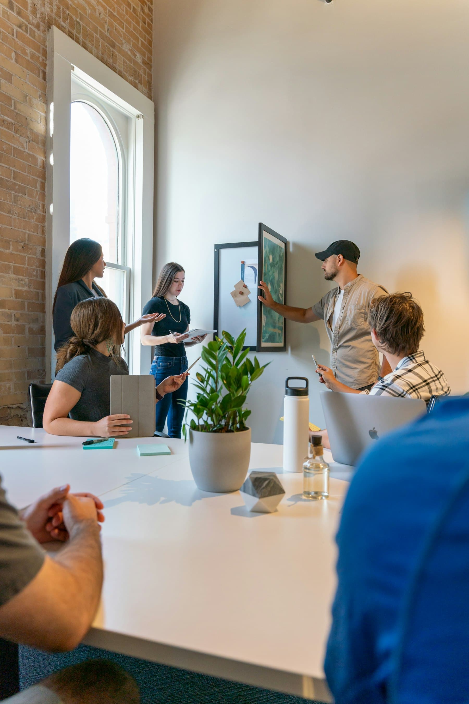 A group standing around a table in a review
